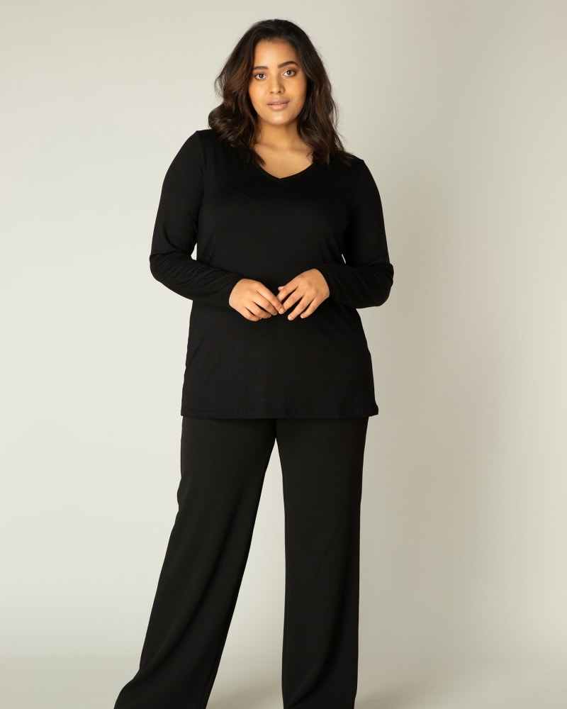 Front of a model wearing a size X-0(44) Alize in Black by Base Level Curvy. | dia_product_style_image_id:279577